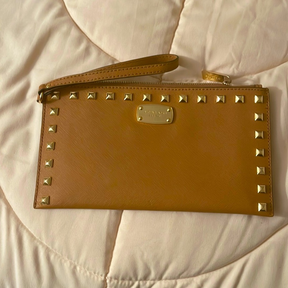 Cognac Michael Kors wristlet. Gently used with one small spot on back.
